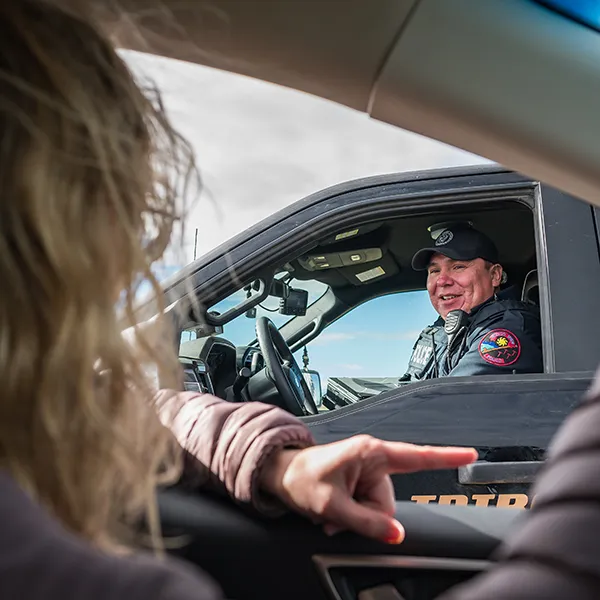 police officer smiling in his vehicle